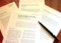 Articles on desk with pen